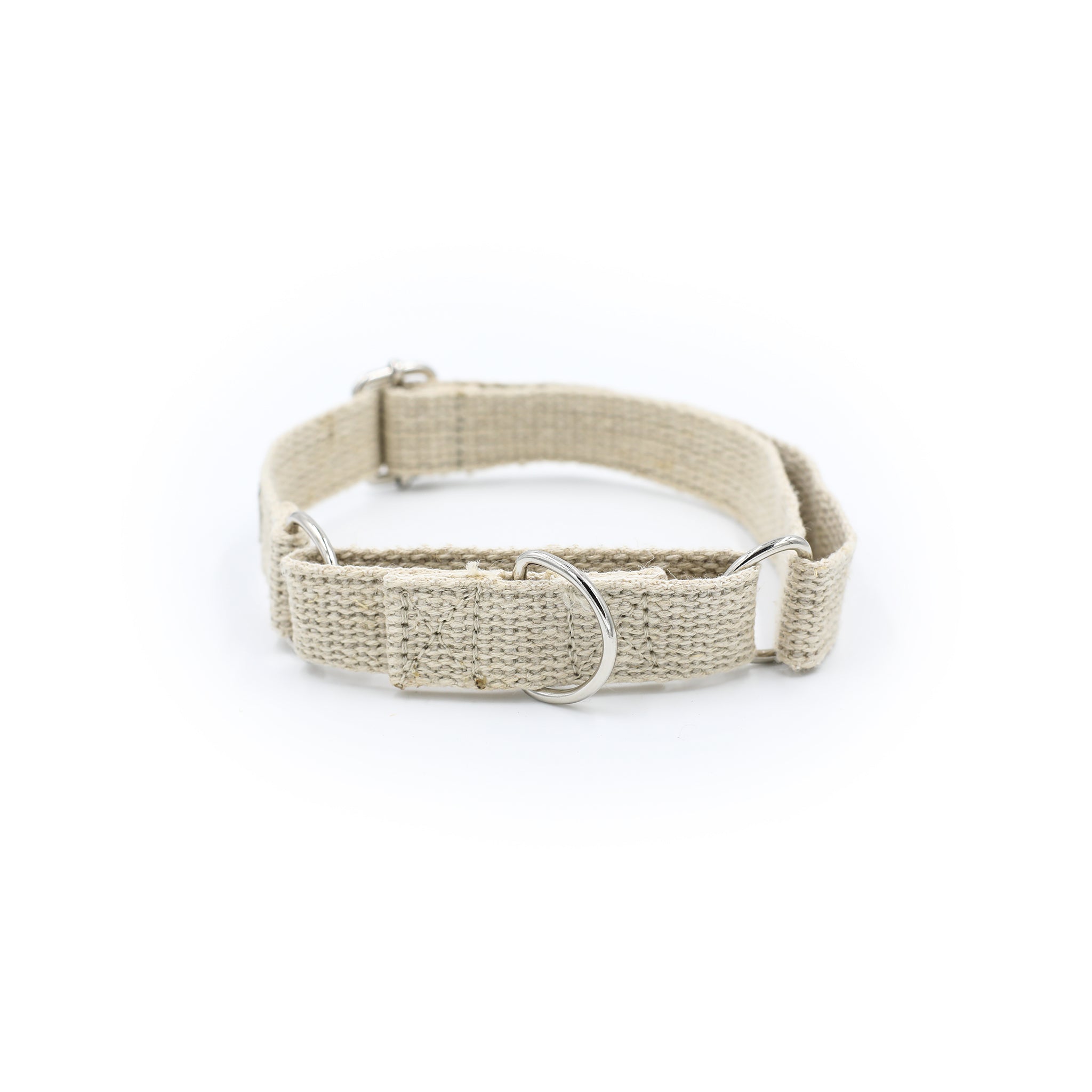 A Hoomans friends natural jute hemp martingale style collar. Placed upon a white background. The natural dog collar is facing so you can see both buckles. This is a size medium.