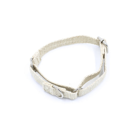 A natural jute hemp martingale style dog collar. The collar is made of woven hemp. The collar is stood on a white background with the two silver metal buckles and silver metal ring visible