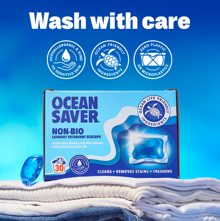 Box of Ocean Saver laundry detergent eco-friendly capsules on a pile of clean laundry
