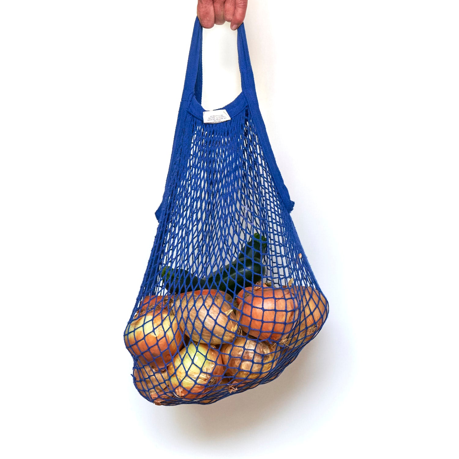 blue string bag carrying vegetables
