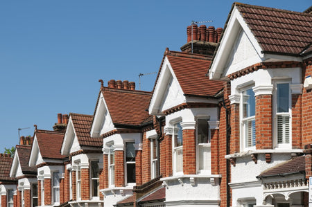 A row of typical british houses during the day.