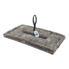 Wool chimney blocker with handle and safety tag attached.