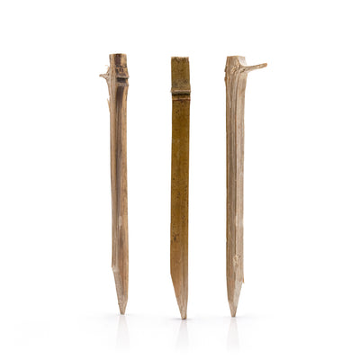 Bag of bamboo garden pegs with two pegs in front on a white background, featuring 'NEW AND IMPROVED' text at the top.