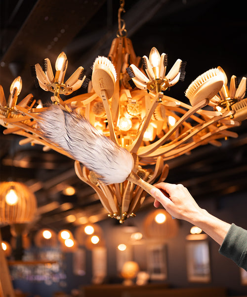 Lambswool duster with solid beechwood handle dusting the top of a picture frame