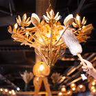 Closeup of lambswool duster and solid beech handle dusting a light made out of Hillbrush natural brushes