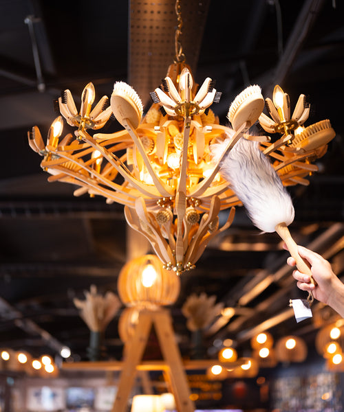 Lambswool duster with solid beechwood handle dusting the top of a picture frame