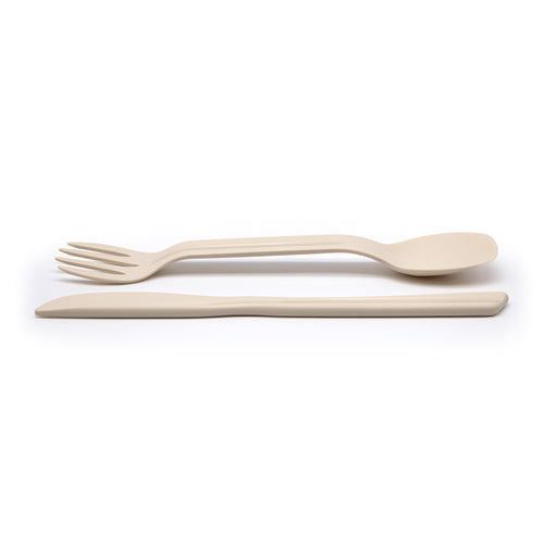 Eco-friendly spork and knife laid out on a white background.