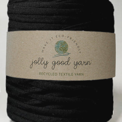 Red yarn ball with a beige label on a white background