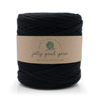A large skein of black jolly good yarn with a brown kraft paper label, shown on a clean white background.