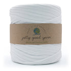 A spool of white recycled textile yarn wrapped in a brown paper band with the brand name 'jolly good yarn' and a small colourful yarn logo, set against a plain white background.
