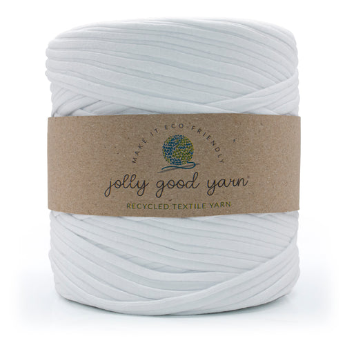A skein of deep blue recycled textile yarn wrapped in a brown kraft paper label that reads 'jolly good yarn'.