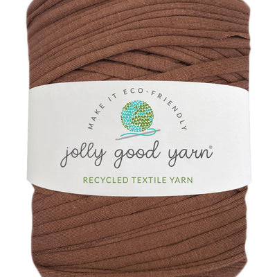 Red yarn ball with a beige label on a white background