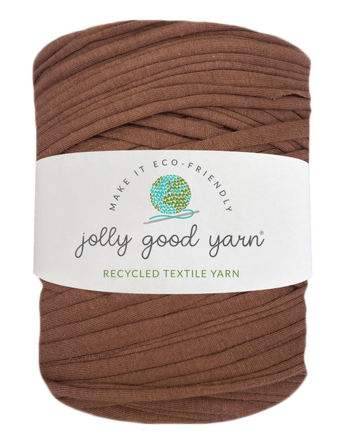 Red yarn ball with a beige label on a white background