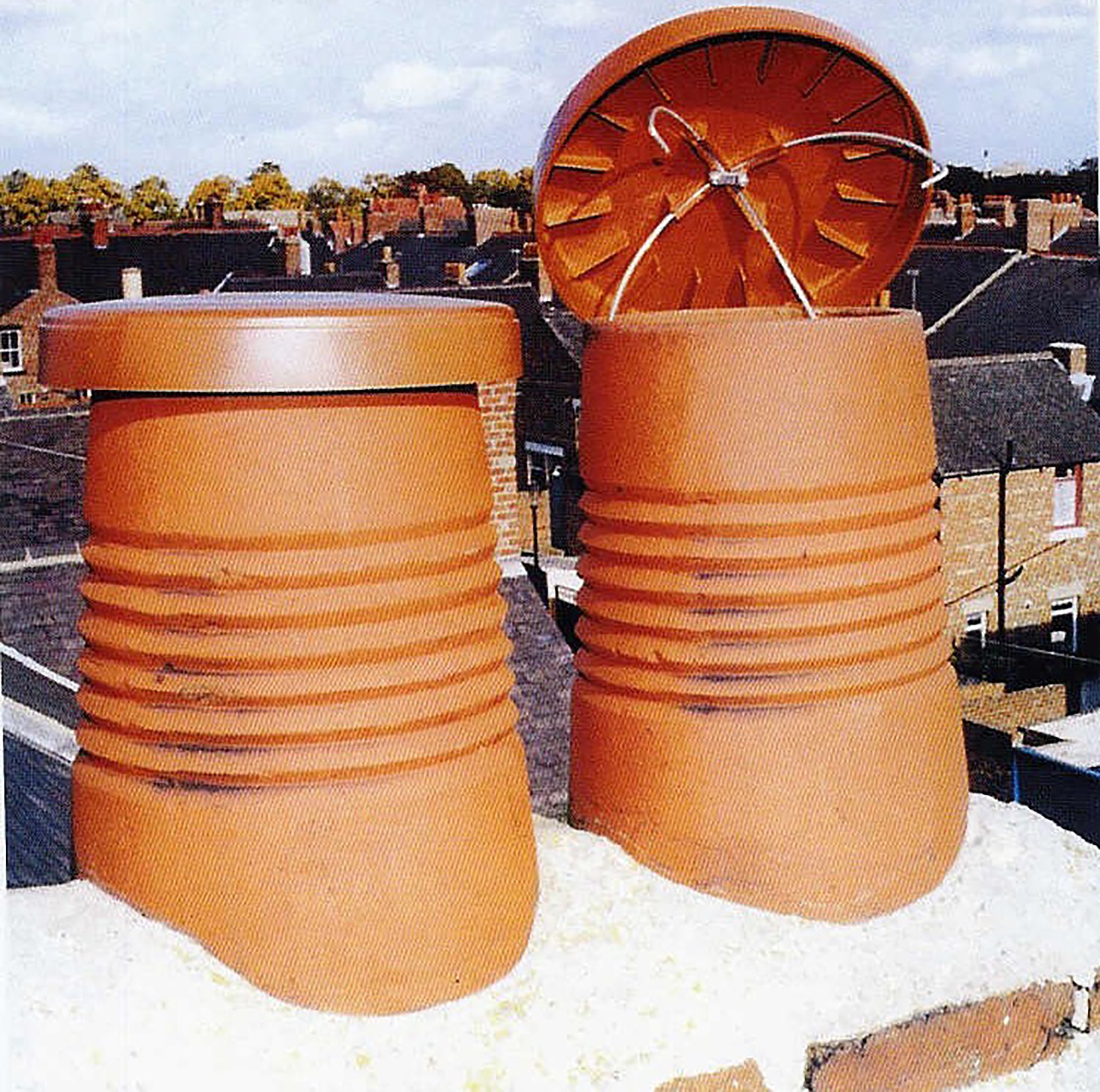 Chimney Pots with chimney caps covering them -C Caps