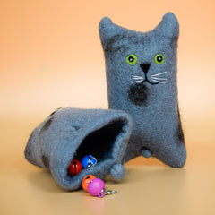 A blue hoomans friends felted wool natural cat toy placed on an orange background thumbnail