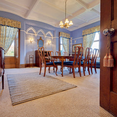 grey wool rug in a dining room thumbnail