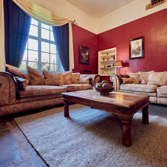 grey wool rug in a living room thumbnail
