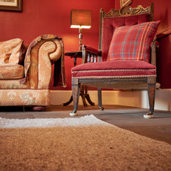 grey wool rug in a living room thumbnail