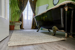 Herdwick wool rug on tiled bathroom floor next to bath for a luxury bath mat  thumbnail