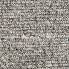 Close-up of the Herdwick and Texel wool rug in shades of grey. 
