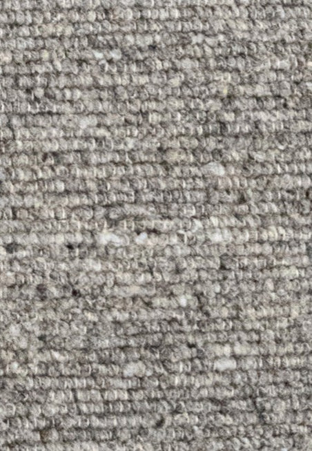 Close-up of the Herdwick and Texel wool rug in shades of grey. 