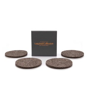 The Lakeland Collection box, displaying four luxury british sheep's wool felted coasters, on a white background