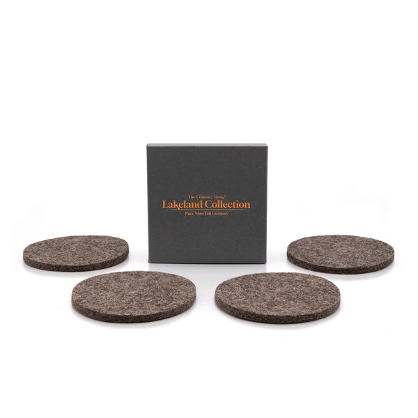 The Lakeland Collection box, displaying four luxury british sheep's wool felted coasters, on a white background