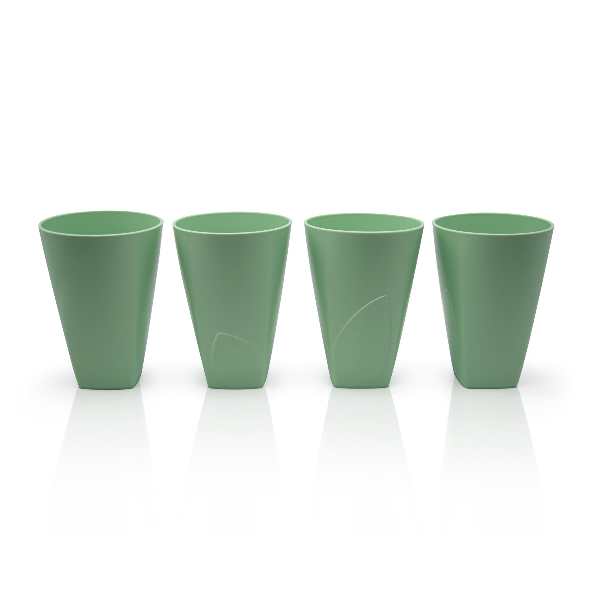 Four bioplastic cups made from waste sugarcane.