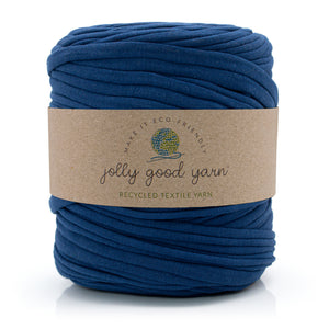A skein of deep blue recycled textile yarn wrapped in a brown kraft paper label that reads 'jolly good yarn'.