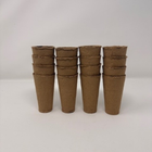Four stacks of four deep root trainers, 16 in total, light brown in colour made of recycled tree fibre. 
