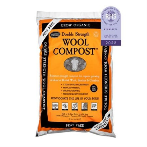 Double Strength Wool Compost in a white bag with an orange box with text on. 