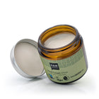 Glass Jar of Fair Squared Olive Oil hand cream with a green label on a white background