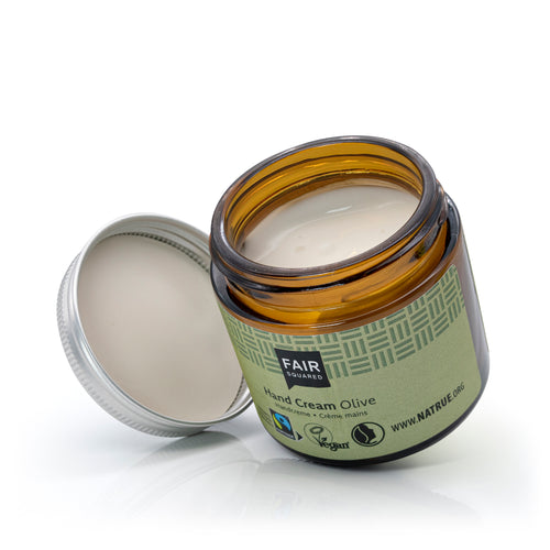 Glass jar with metal screw top lid of Fair Squared Olive Oil Hand Cream