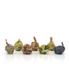 Set of 7 natural beeswax firelighters on a white background. 