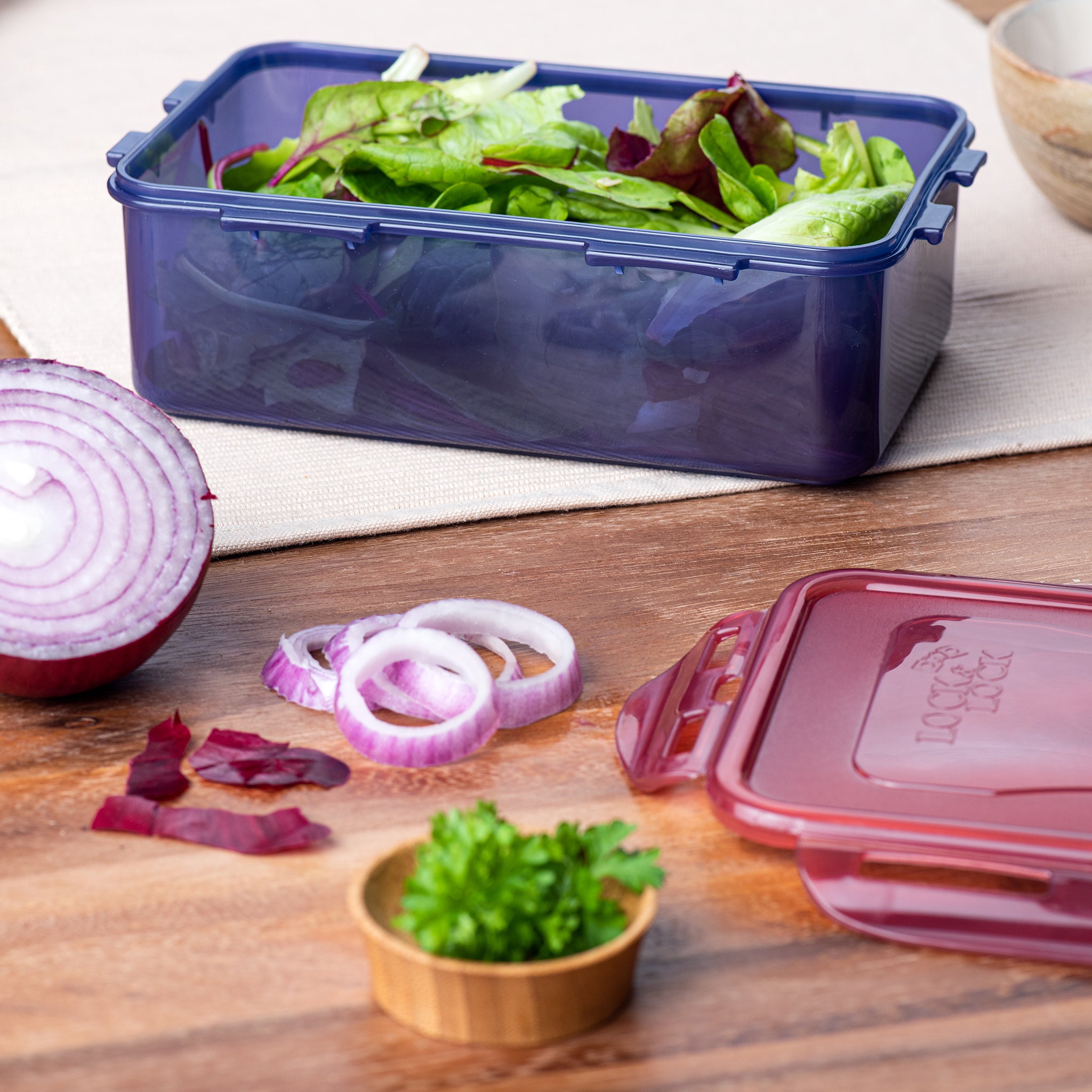 lunch box in use with salad