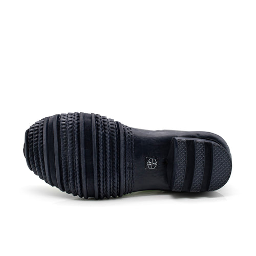 Pair of green rubber boots with black soles on a white background