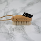 keyboard brush made of FSC wood and natural bristles on marble background
 