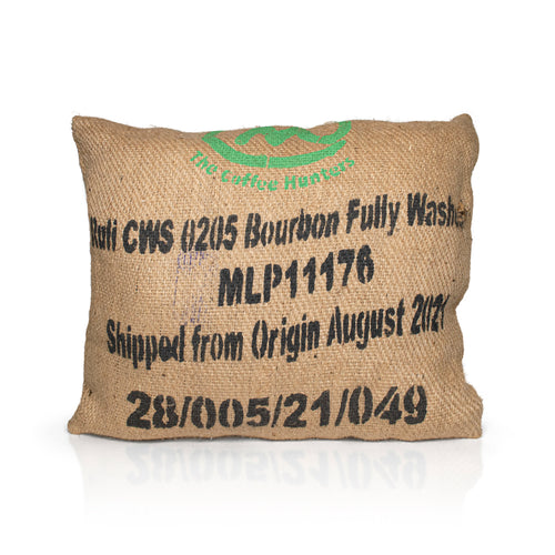 A mix off wool filled, jute hessian outdoor cushion