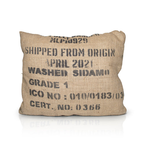 A mix off wool filled, jute hessian outdoor cushion