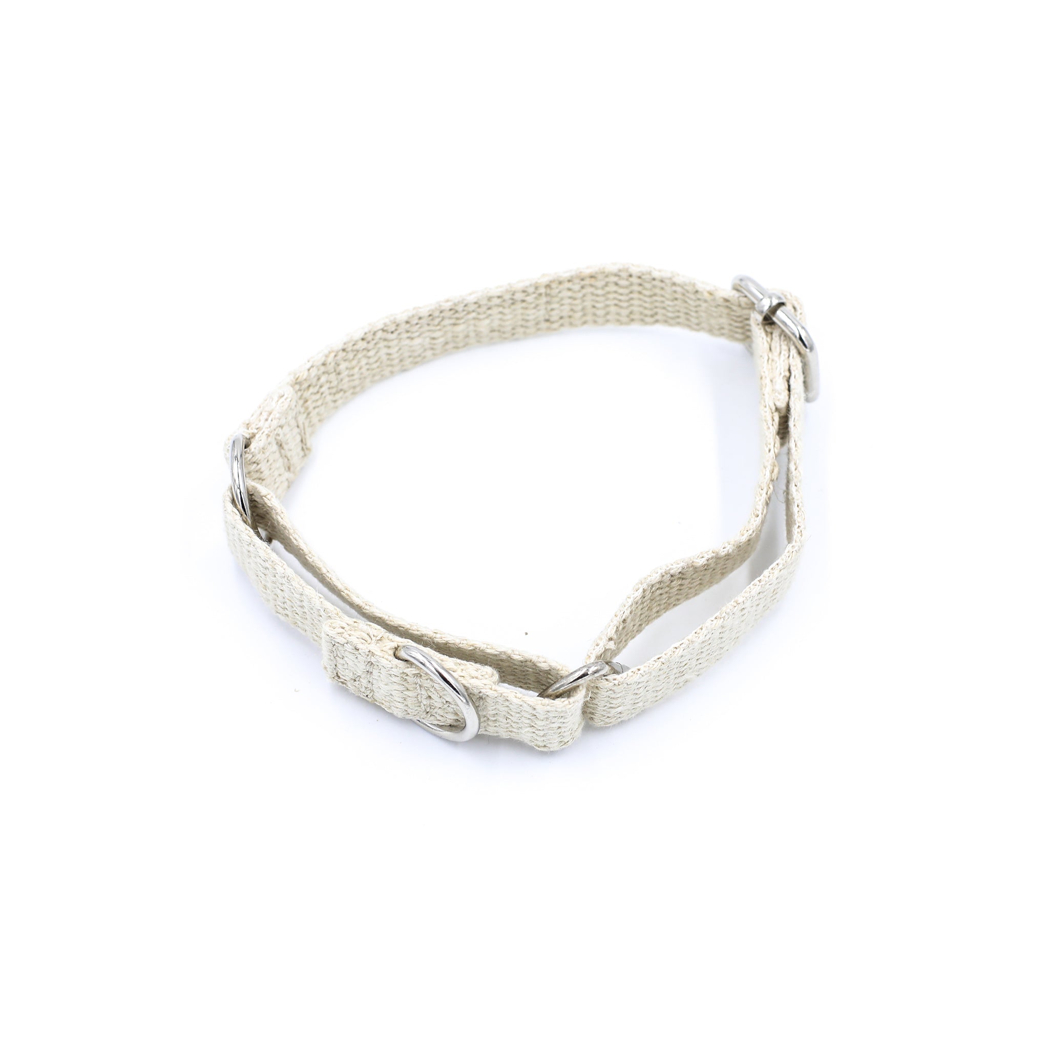 An eco-friendly natural, plastic free, martingale dog collar. Placed on a white background. The collar has two silver buckles and a stitched white cotton logo