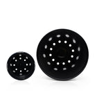 Large and small plastic plant pot from top down view.