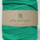 Green yarn ball with a 'jolly good yarn' label on a white background