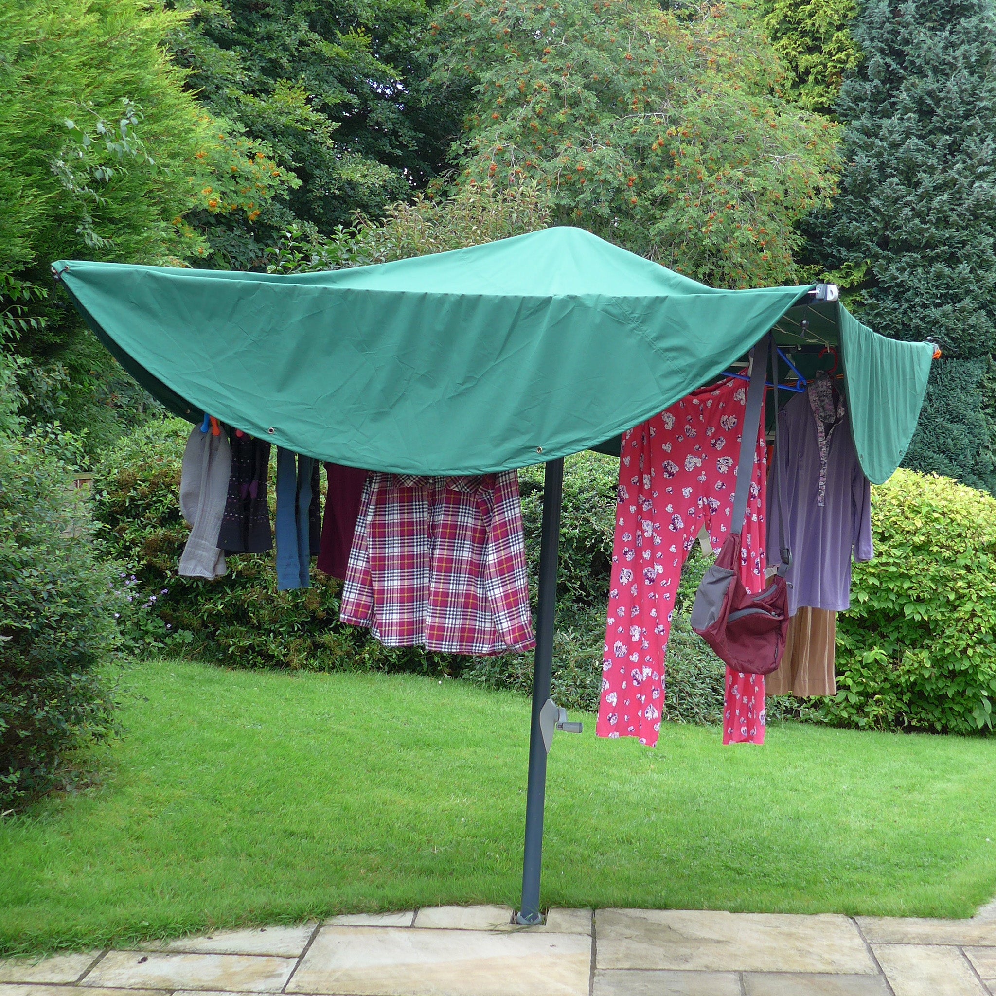 Large Laundry Mac™ for large four armed rotary dryer sheltering load of washing on the line