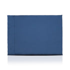 Blue luxury dog bed made of organic fabric filled with sheep wool felt on a white background