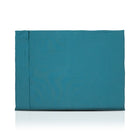 Teal luxury dog bed made of organic fabric filled with sheep wool felt on a white background