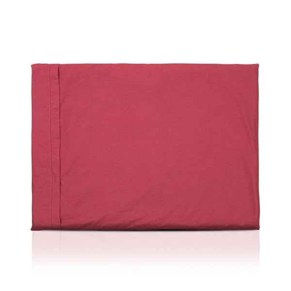 Red luxury dog bed made of organic fabric filled with sheep wool felt on a white background