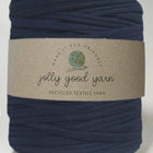 Ball of navy blue yarn with a 'jolly good yarn' label on a white background