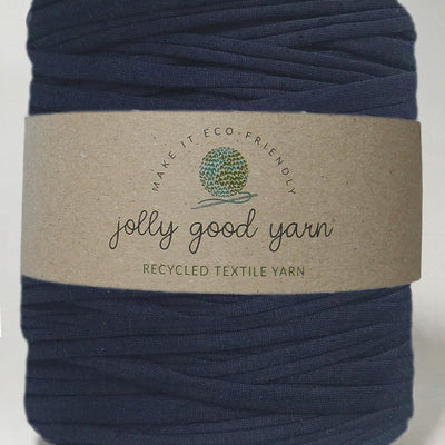 Red yarn ball with a beige label on a white background