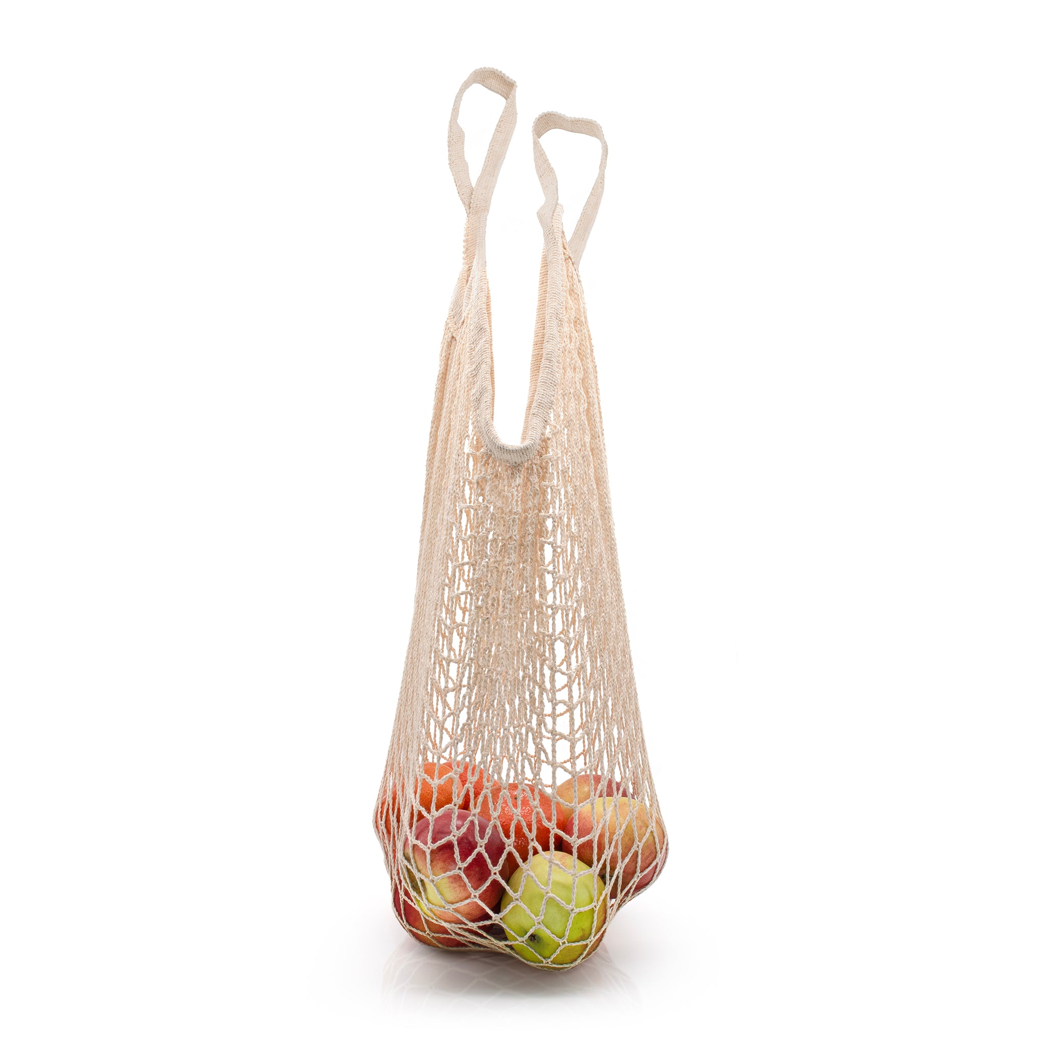 Eco-friendly cotton bag carrying apples. 