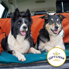 Two collie dogs sitting in a car on roll-up dog bed  with a 'Gift of the Year' award badge.
